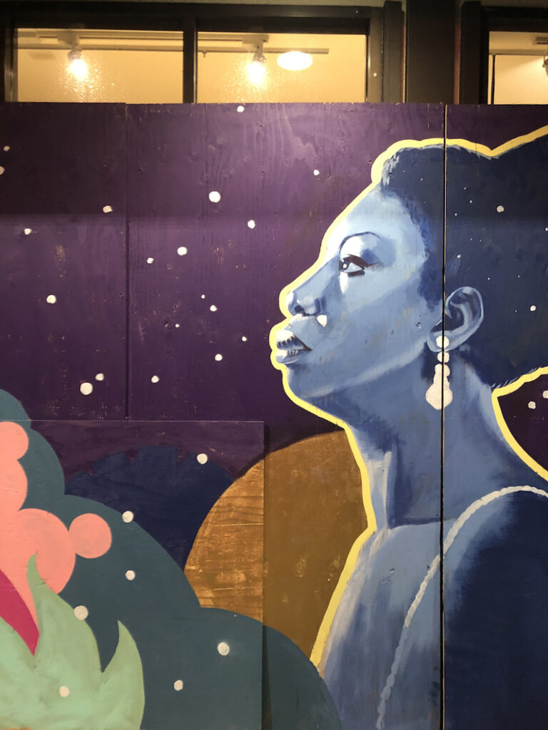 A mural of Nina Simone in an abstract nightscape