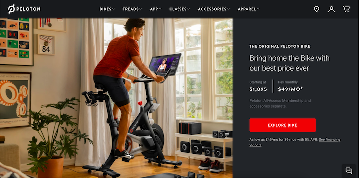 Screenshot of Peloton's website, with a rider on a Peloton in front of a large window with neatly arranged home gym equipment underneath.